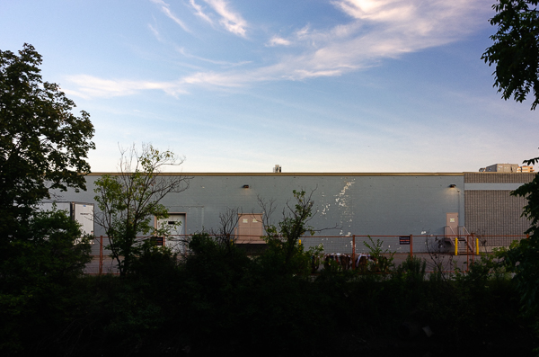 a sunset and the back of a store