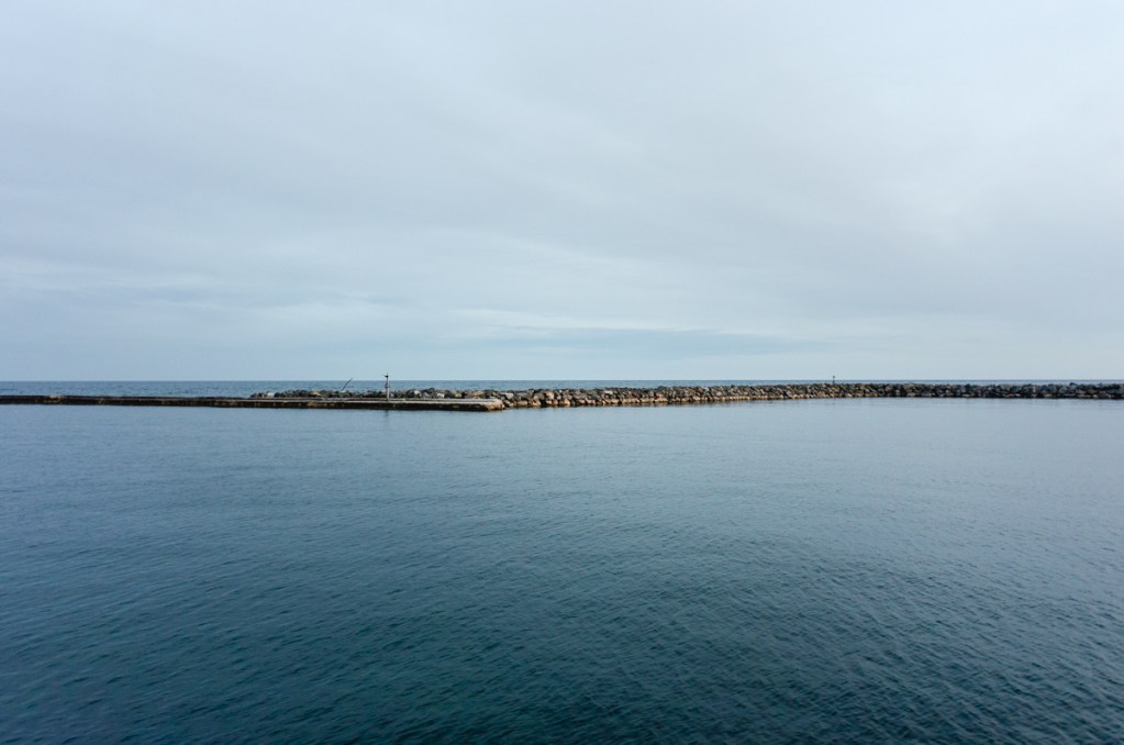 A minimal landscape image of Lake Ontario.