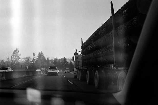 black and white photograph of a highway in canada