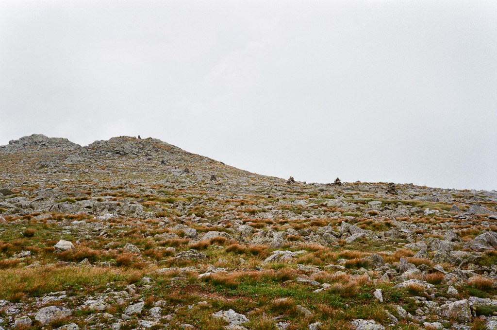 a landscape image of a mountain ridge on mt washington