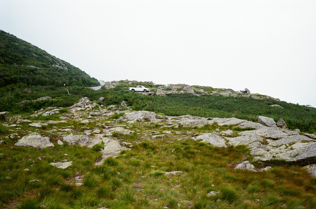 landscape image of a pickup truck on a mountain