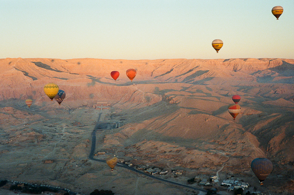 photograph of hot air balloons in front of the west bank in Luxor Egypt